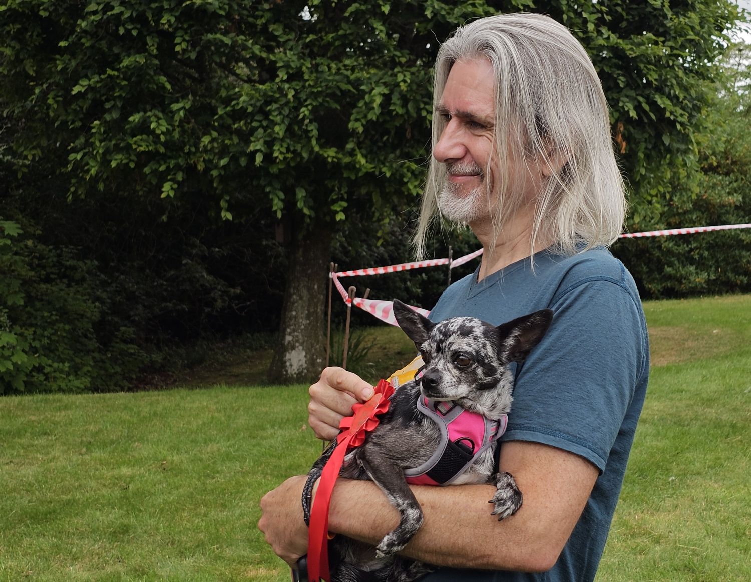 Leela, the Chihuahua, in the arms of David, her owner
